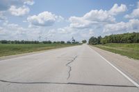 Iowa Road Through Asphalt Field in Bancroft