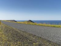 Island Horizon: Clear Sky and Calm Waters