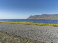 Island Horizon: Clear Sky and Calm Waters