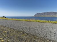 Island Horizon: Clear Sky and Calm Waters