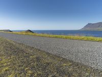 Island Horizon: Clear Sky and Calm Waters