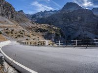 motorcycle riding through the mountains in the middle of summertime for a road view image