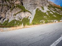 this is a photo of the road in front of the mountains on a clear day