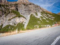 this is a photo of the road in front of the mountains on a clear day