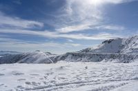 there are many tracks and traces in the snow of this area, where skiers are seen from atop