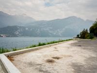 Italy Scenic Road with Lake and Mountains View