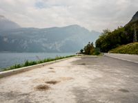 Italy Scenic Road with Lake and Mountains View