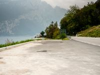 Italy Scenic Road with Lake and Mountains View
