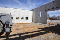 the construction site has been used to fill up the space for the concrete building as part of a concrete building renovation