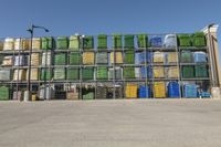 a group of bins on shelves in front of a warehouse with lots of empty containers