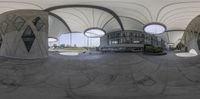 a 360 - view picture looking at the building as seen through the camera lens of a mirror