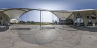 a large dome building is next to two benches in front of the benches outside the building