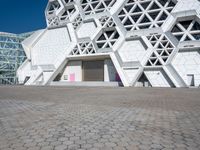 this is the entrance to a museum of art and design with geometric white architecture, designed by david young