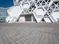 this is the entrance to a museum of art and design with geometric white architecture, designed by david young