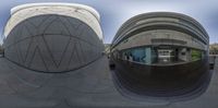 a reflection of a modern building shows off in a ball shaped view as you walk down a sidewalk