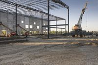 the large building is being built with concrete and construction equipment in progress to make way for a new construction project