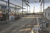 the large building is being built with concrete and construction equipment in progress to make way for a new construction project