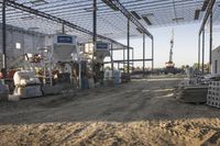 the large building is being built with concrete and construction equipment in progress to make way for a new construction project