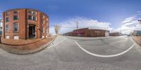 this is an image of a fish eye view of a round building and street corner