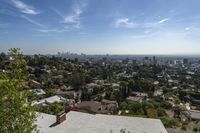 a view of the city and some trees from the roof of a house in la jolla neighborhood