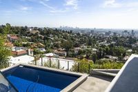 a view of the city and some trees from the roof of a house in la jolla neighborhood