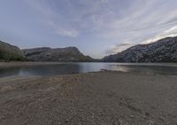 an image of a lake in a mountainous area with a nice sky and some clouds