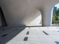 this is an architectural picture of a large building in china, with a circular entrance on the corner