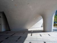 this is an architectural picture of a large building in china, with a circular entrance on the corner