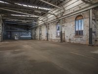 large industrial building with many windows in it's walls and a door leading to another room