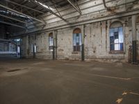 large industrial building with many windows in it's walls and a door leading to another room