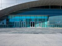 the front entrance to an airport is almost empty, which is quite clear from all of the elements