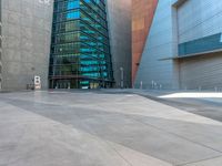 the city has a very long stone paved street outside the center, with blue windows and reflections on the side of it