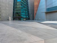 the city has a very long stone paved street outside the center, with blue windows and reflections on the side of it