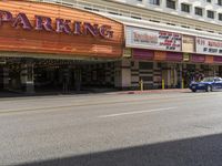 parking is a feature in the new movie theater's opening night displays below a marquee