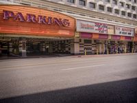 parking is a feature in the new movie theater's opening night displays below a marquee