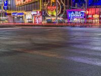 Las Vegas at Night: Streets Illuminated by Dark Neon Lights