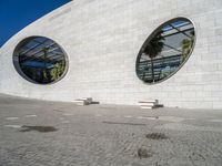 a building that has a large circular window in it's side wall that looks like some kind of building