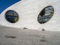 a building that has a large circular window in it's side wall that looks like some kind of building