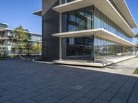 an outside view of some building with many windows and concrete patio areas area for outdoor seating