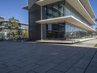 an outside view of some building with many windows and concrete patio areas area for outdoor seating