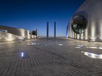 the building is lit up with many different things on it and features white lights and blue