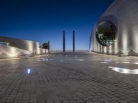 the building is lit up with many different things on it and features white lights and blue