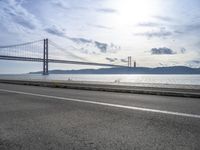 Lisbon Cityscape with Coastal Road and Bridge