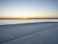 the person is riding a bicycle on the beach at sunset timesign to get some exercise in the water