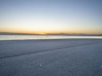 the person is riding a bicycle on the beach at sunset timesign to get some exercise in the water