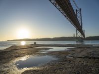 Lisbon Harbor at Dawn with Clear Sky and Sun Burst