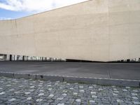 the building with a small area and a few columns is very wide in the middle of the stone