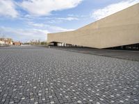 an empty area with gray stones and a sky background on a sunny day in the city