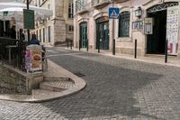 a street with stairs leading up to some people who are eating in an outdoor market