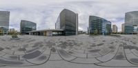 this is an image of a 360 - view camera lens lens of buildings and a circular driveway